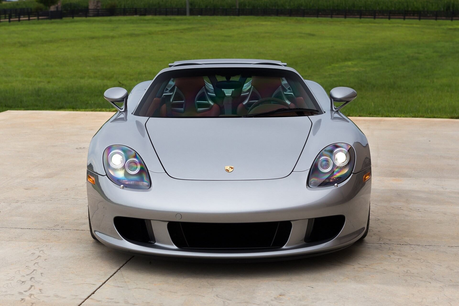 frontal view of a silver 2005 Porsche Carrera GT