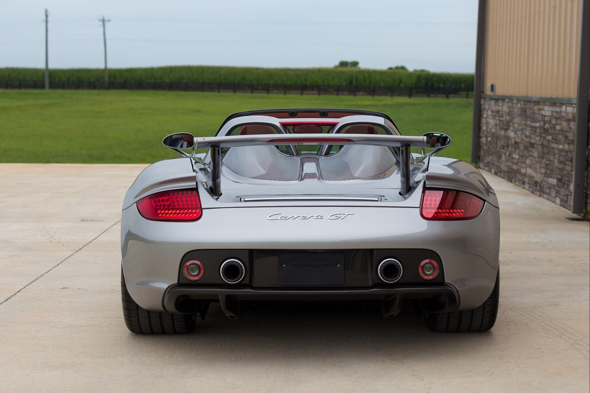 rear profile of a silver 2005 Porsche Carrera GT