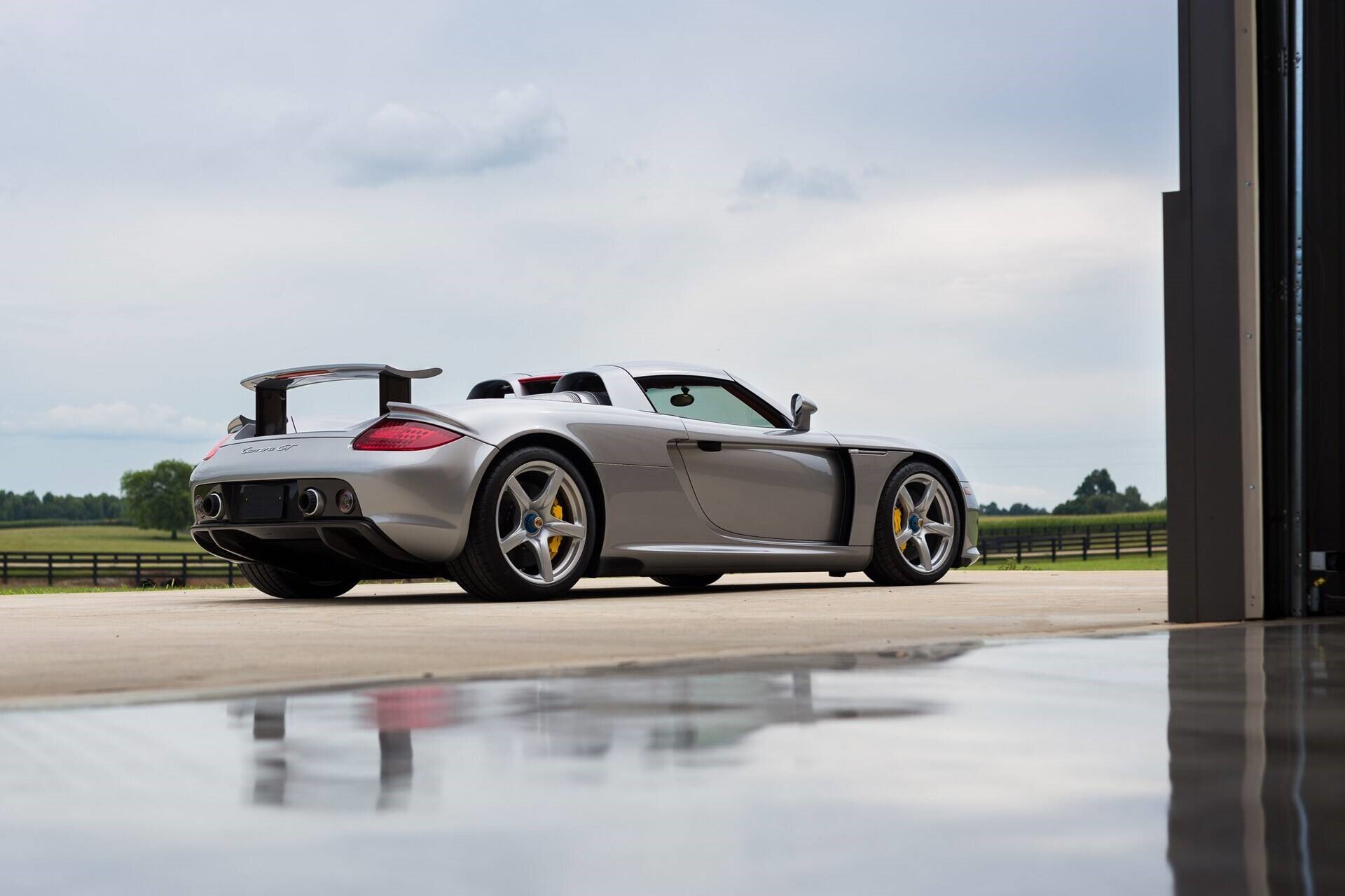 rear-angled view of a silver 2005 Porsche Carrera GT