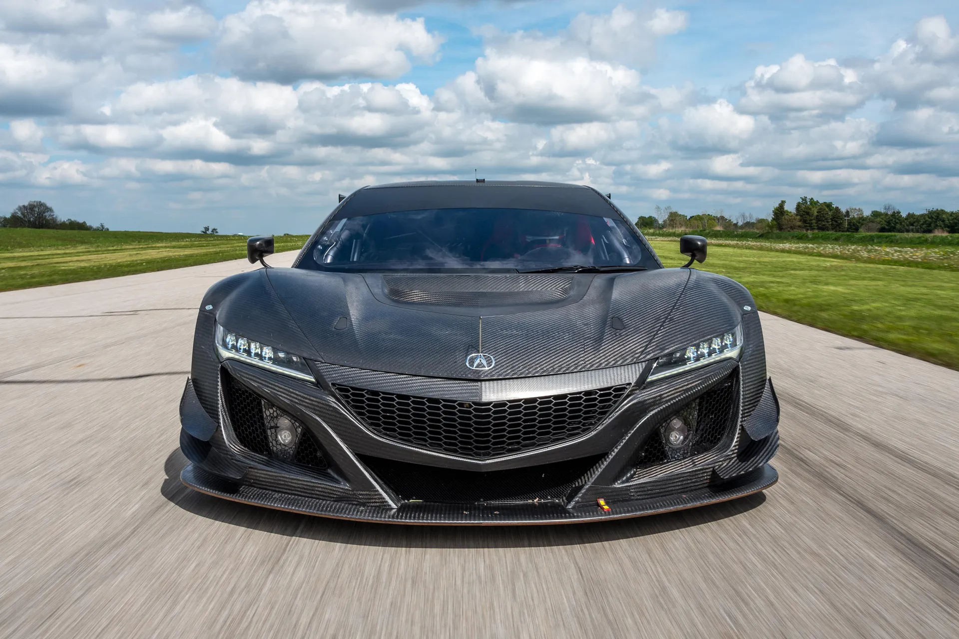 frontal view of a full carbon fibre Acura NSX GT3 race car.
