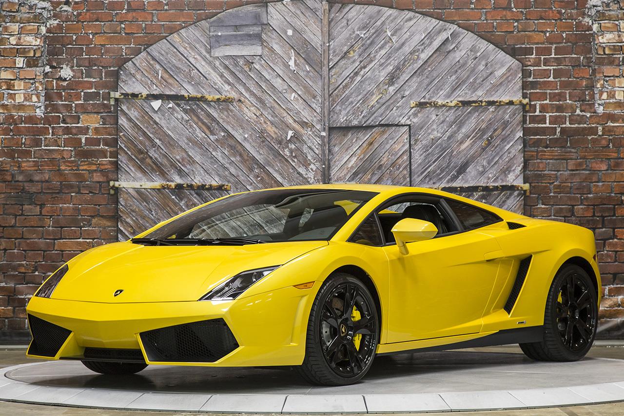 Front-angled view of a yellow 2013 Lamborghini Gallardo coupe