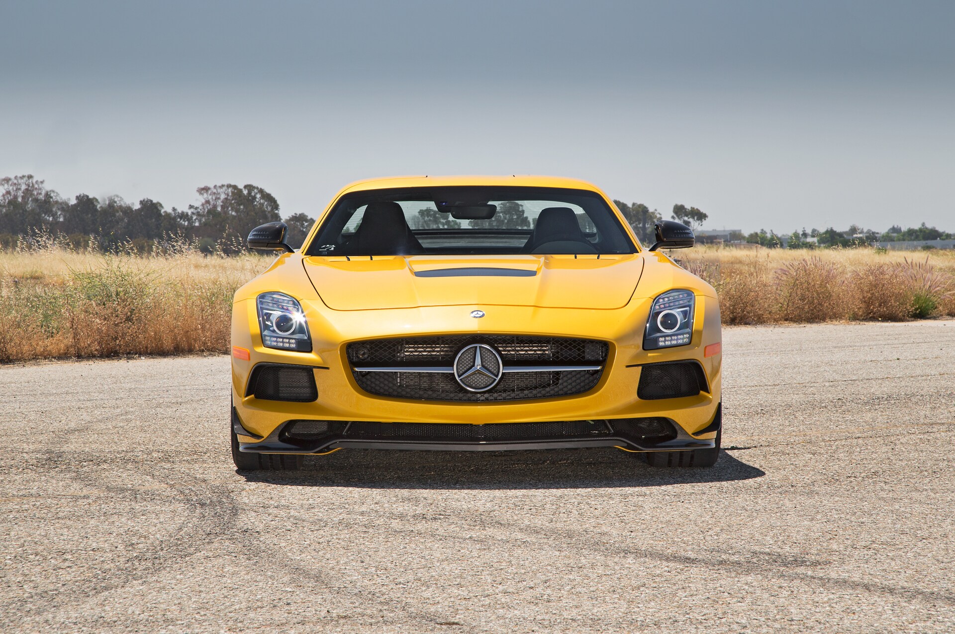 frontal view of a yellow 2014 Mercedes Benz SLS AMG Black Series