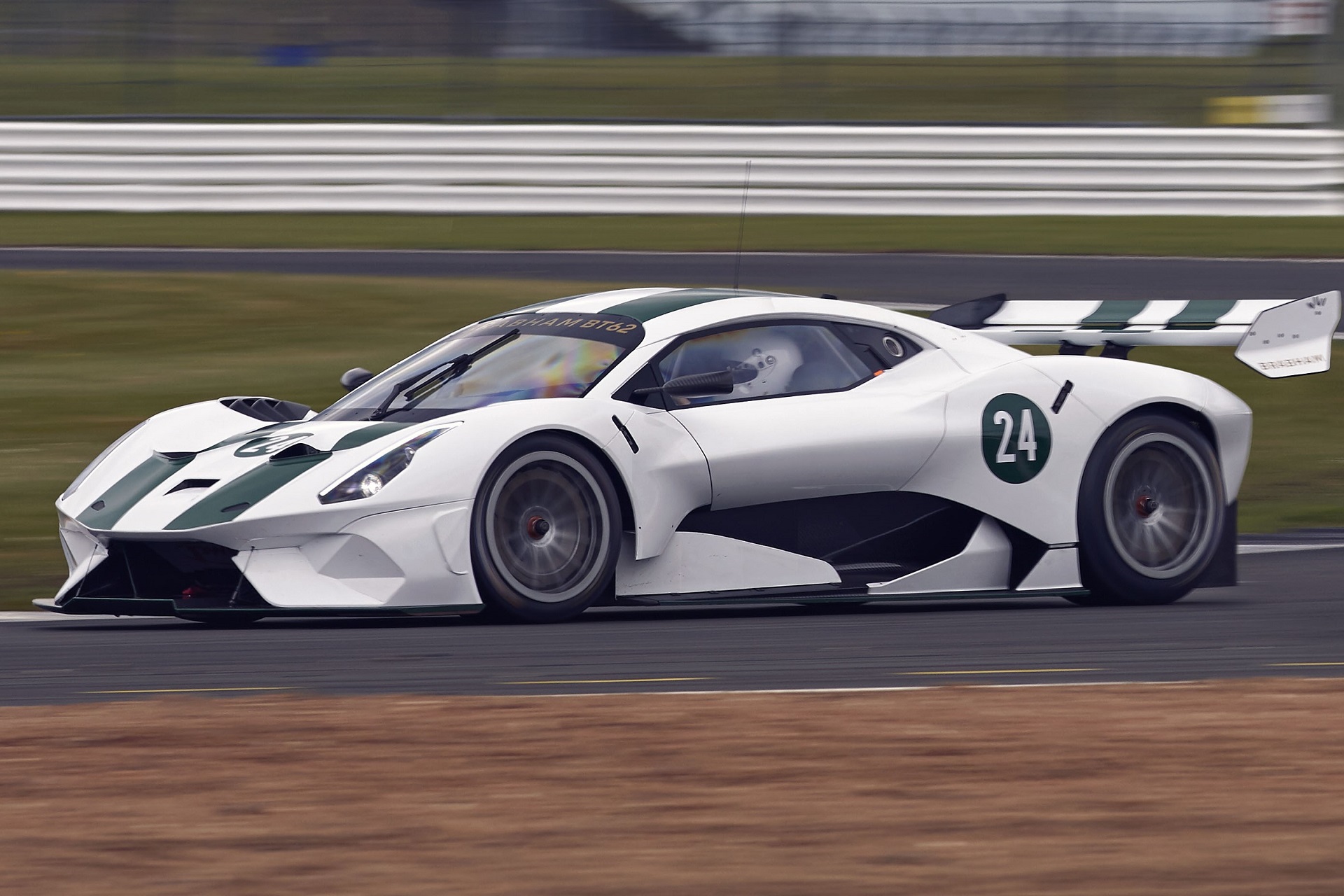 Rolling shot of a white Brabham BT62 on a race track.