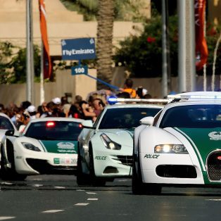 Image showing a Bugatti Veyron, Ferrari FF, McLaren MP4-12C and Bentley Continental GT - all part of the Dubai Police Force.
