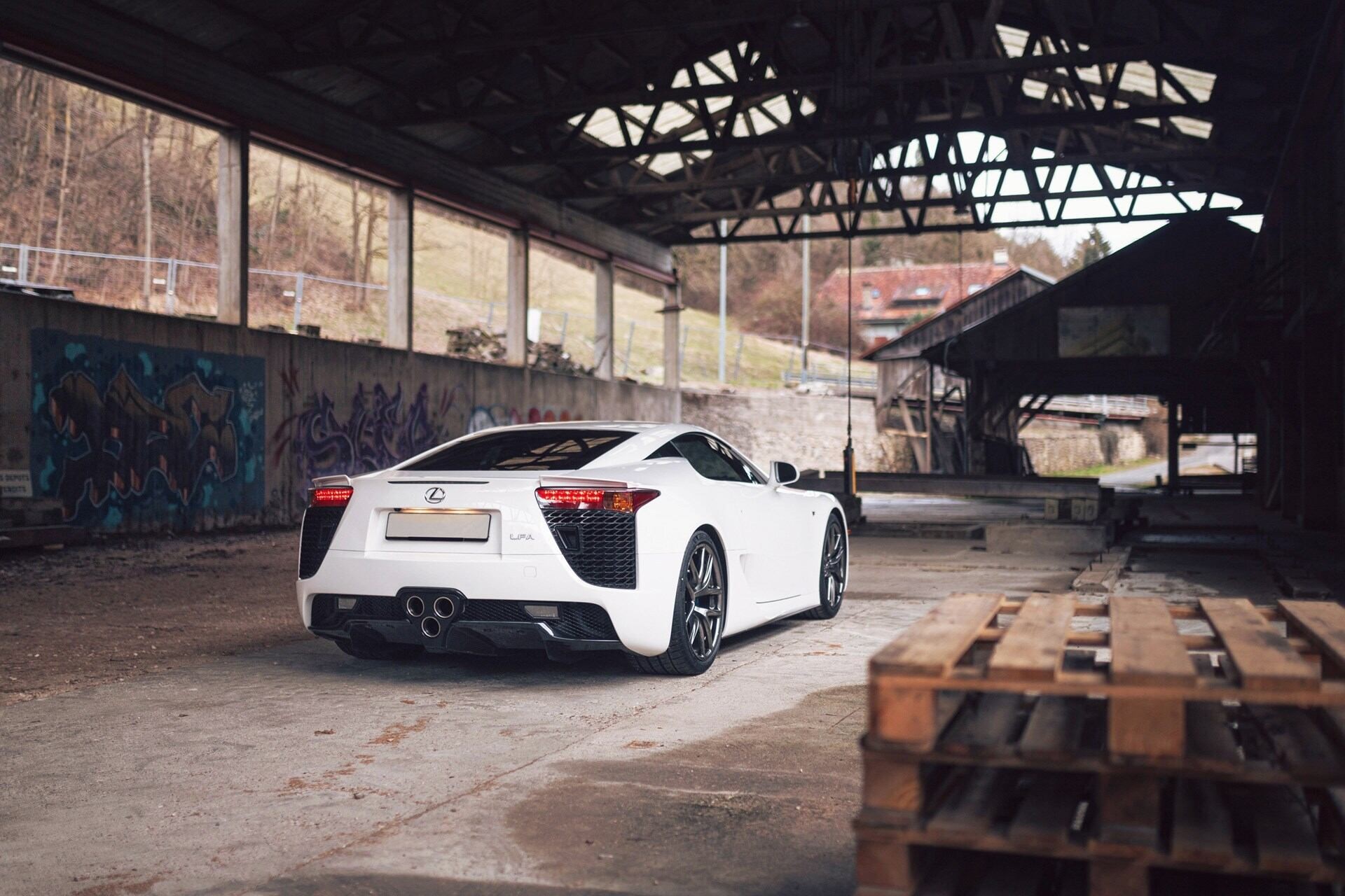 rear-angled view of a white 2011 Lexus LFA