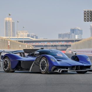 Front angled view of a blue 2022 Aston Martin Valkyrie AMR Pro.