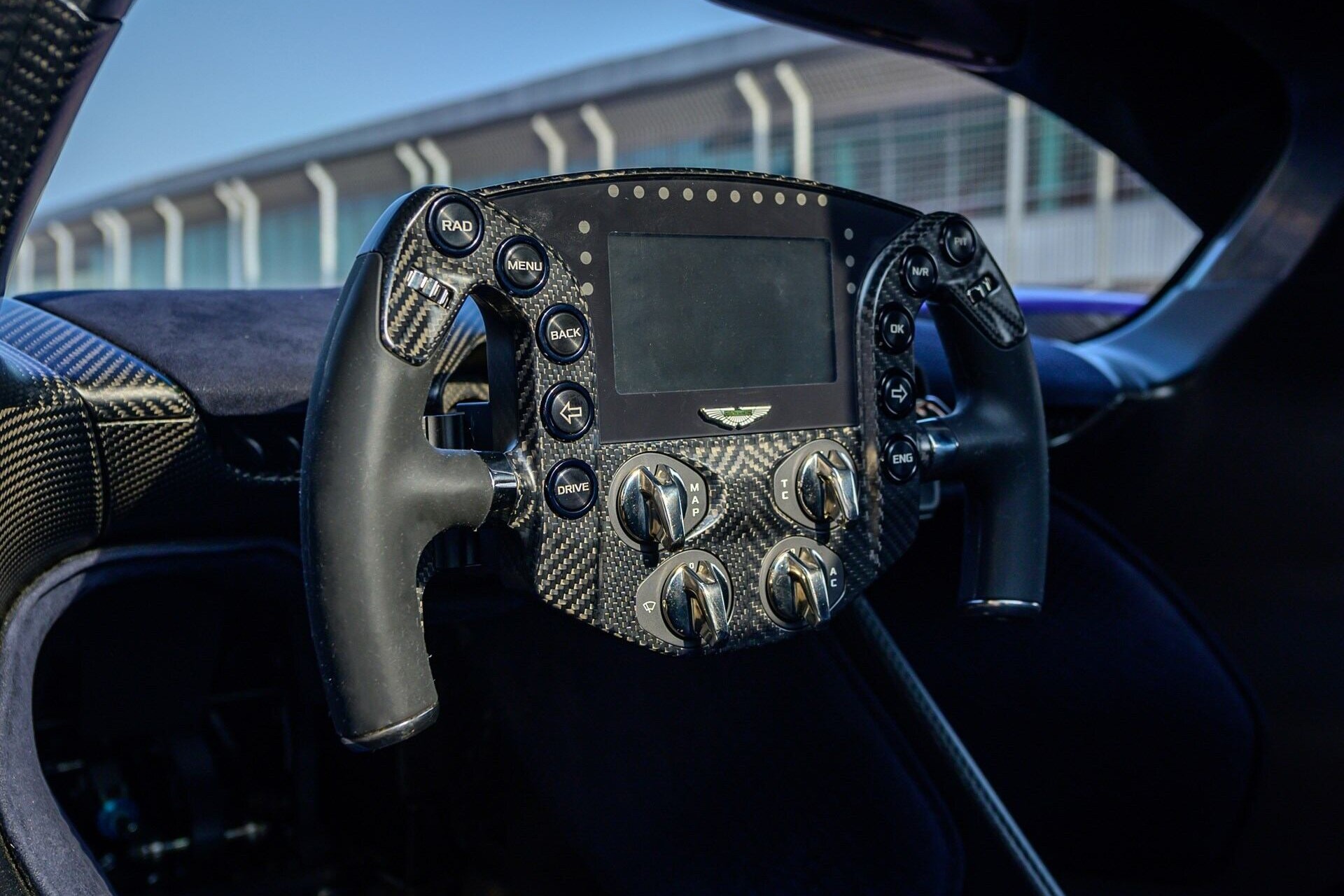 Steering wheel of a blue 2022 Aston Martin Valkyrie AMR Pro