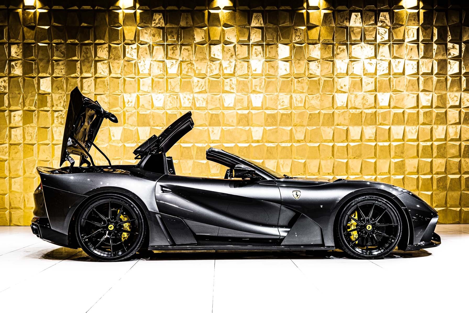 side profile of a Ferrari 812 GTS by Novitec N LAGRO showing the roof mechanism in action.