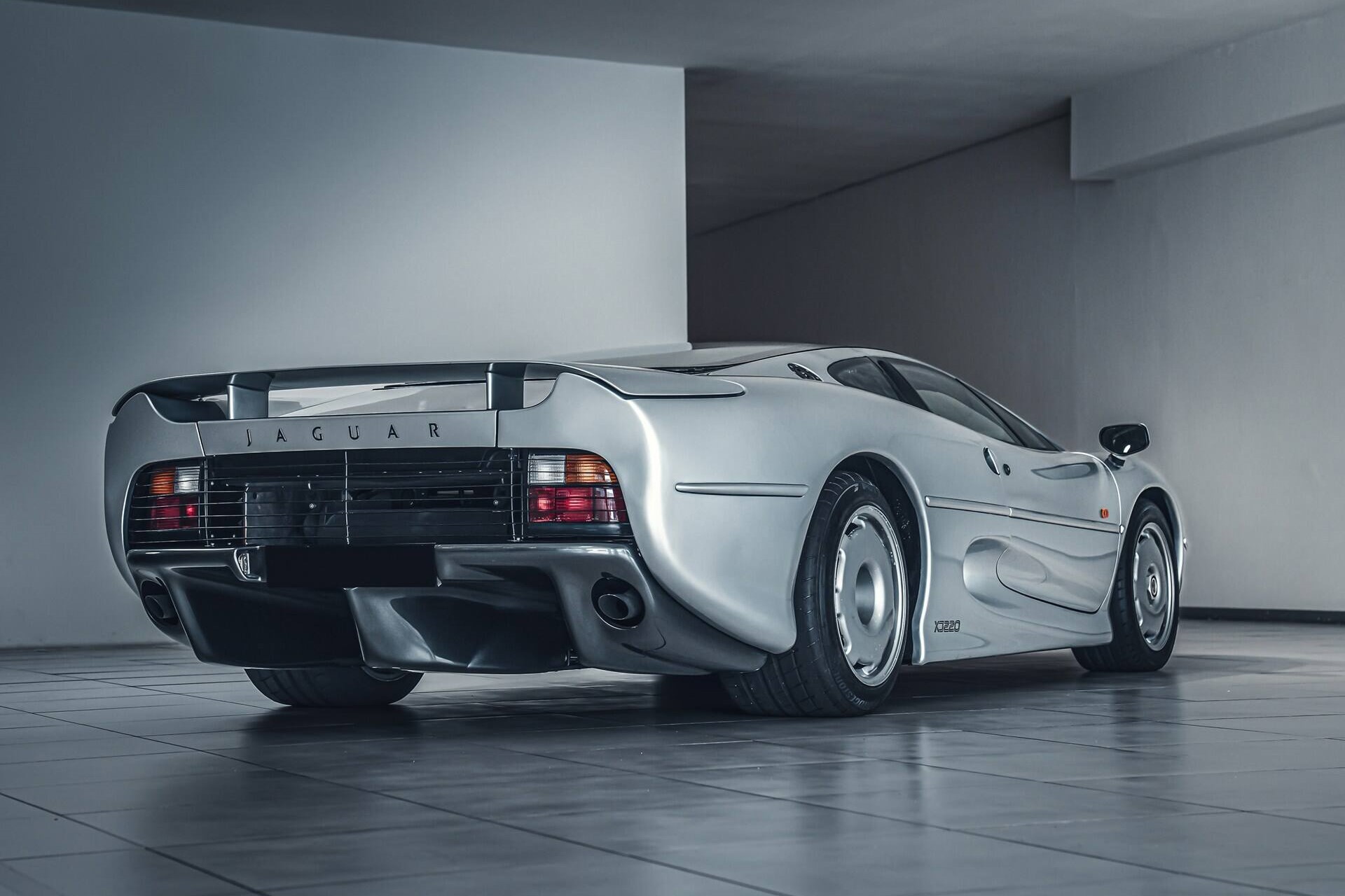 rear angled view of a silver 1993 Jaguar XJ220