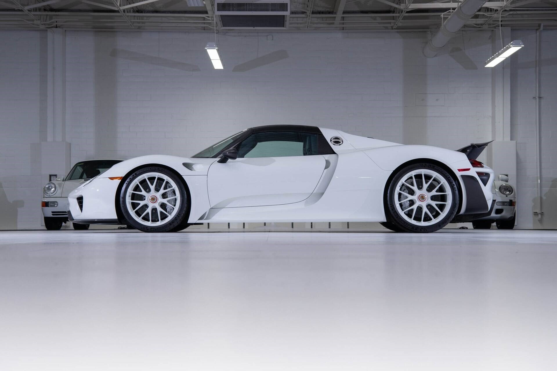 side profile of a white 2015 Porsche 918 Spyder