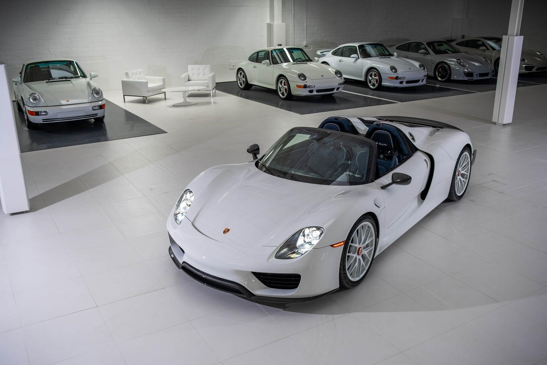 Aerial angled view of a white 2015 Porsche 918 Spyder