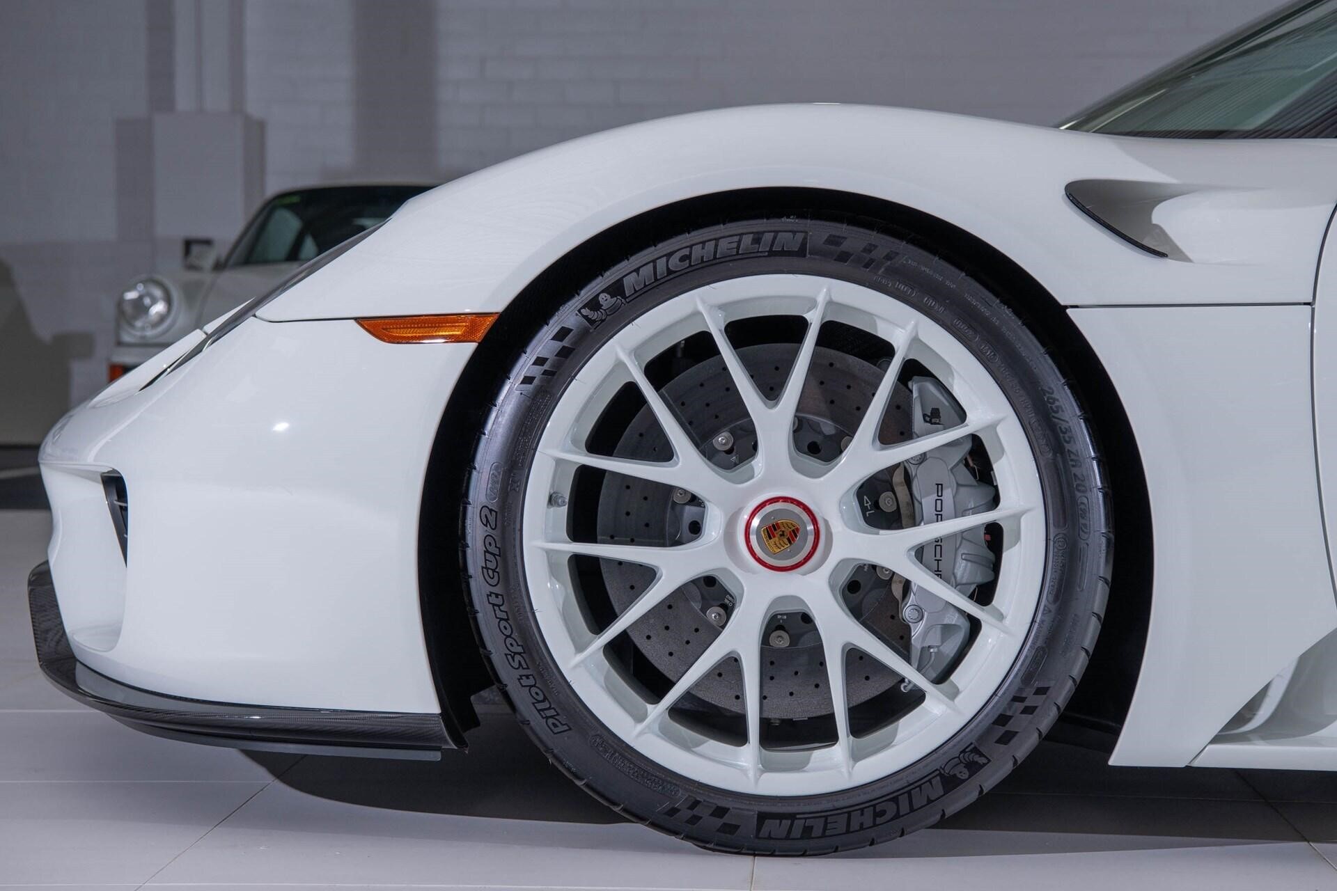 Close up image of a white magnesium wheel of a white 2015 Porsche 918 Spyder