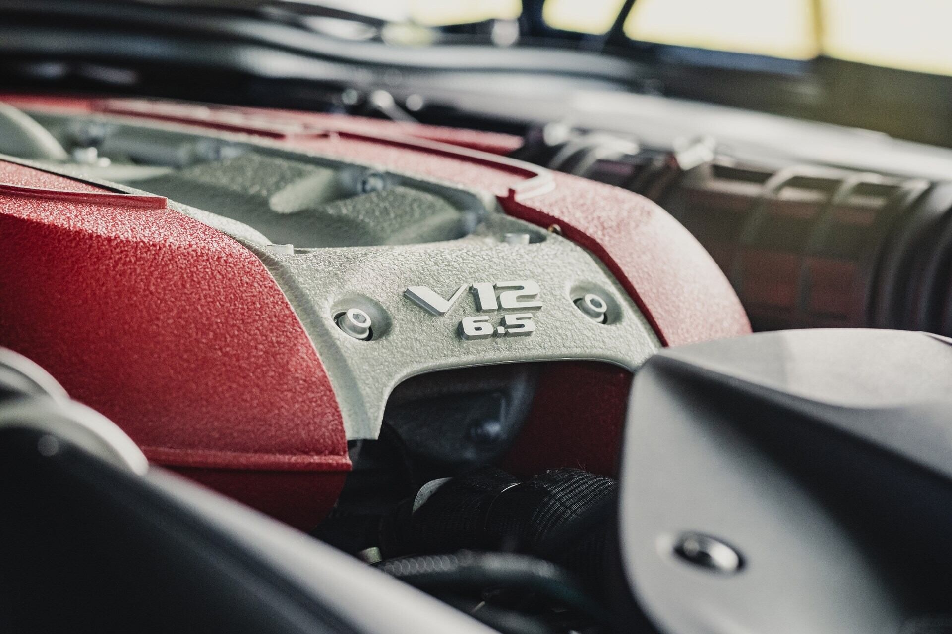 image showing the V12 badging of a blue 2020 Ferrari 812 GTS