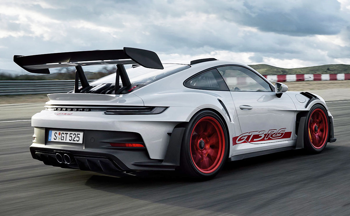 Rear-angled view of a 2023 Porsche 911 GT3 RS on a race track