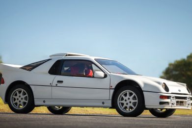 Three-quarter side view of a white Ford RS200 Evolution