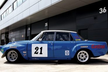 Side view shows off the lightweight four-door body’s bulging fenders and hood