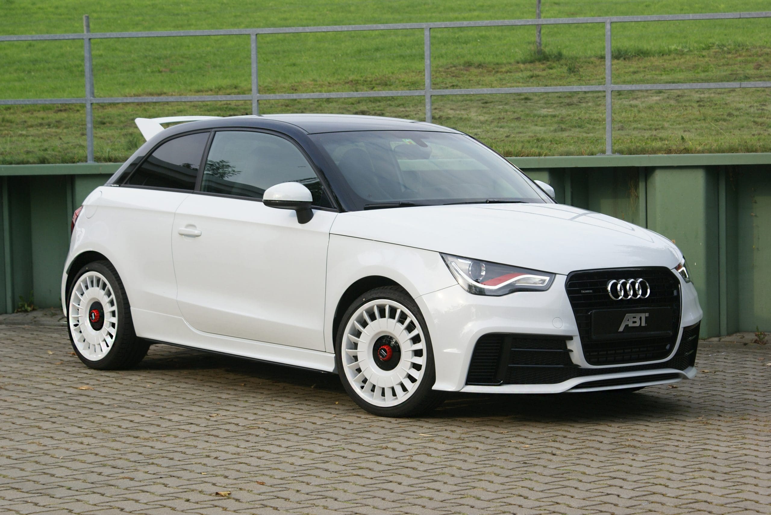 Three-quarter front view of a white Audi 8X A1 Quattro