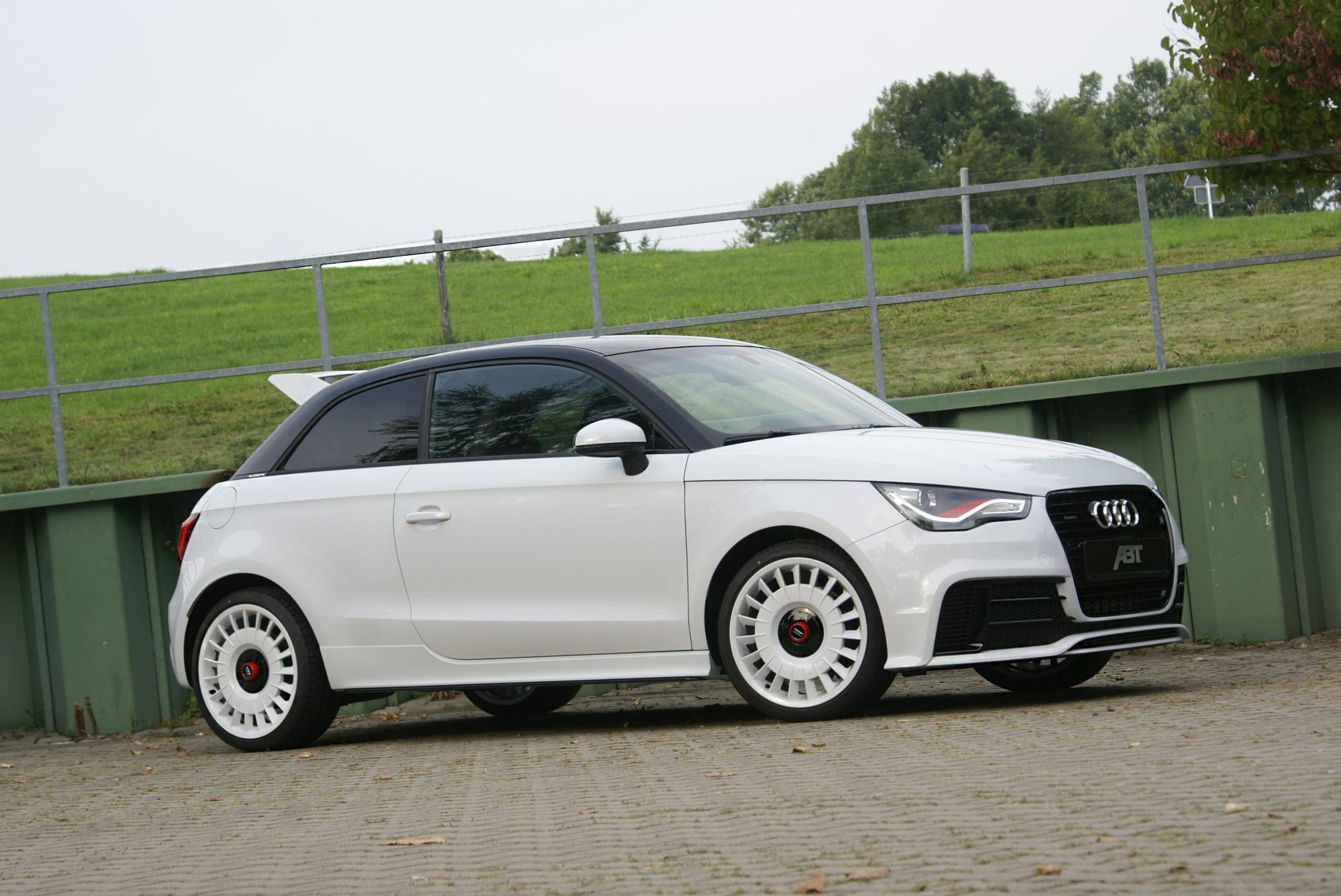 Three-quarter front view of a white Audi 8X A1 Quattro