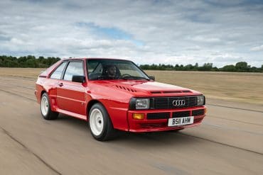 Three-quarter front view of a 1984 red Audi Sport Quattro