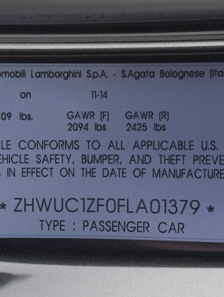 VIN plate on a 2015 Lamborghini Huracan door jamb showing vehicle identification number and manufacturing details