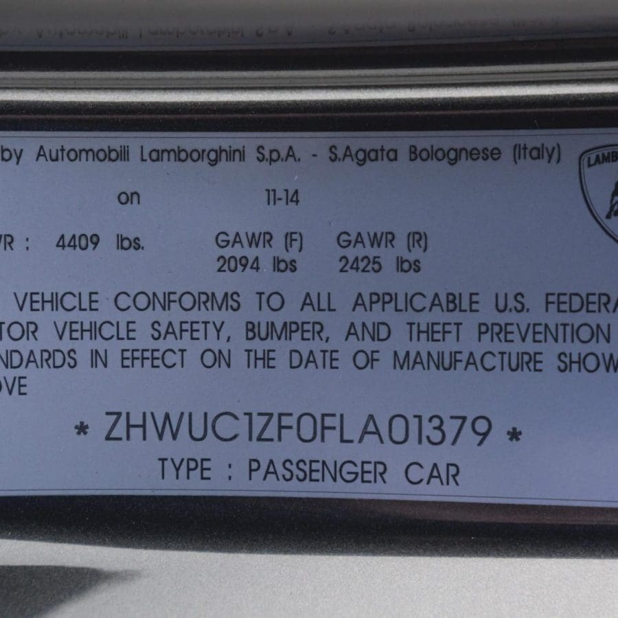 VIN plate on a 2015 Lamborghini Huracan door jamb showing vehicle identification number and manufacturing details