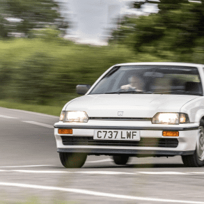 White 1985 Honda CR-X on a country road