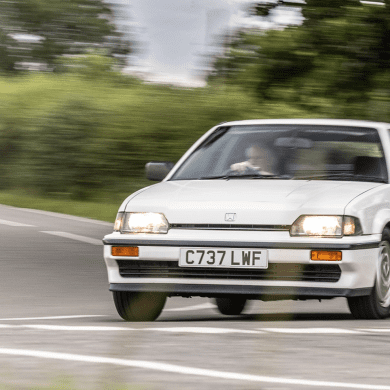 White 1985 Honda CR-X on a country road