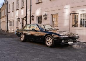 3/4 front view of a 1988 black Ferrari 412