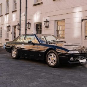 3/4 front view of a 1988 black Ferrari 412